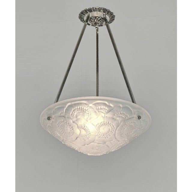 VERDUN - les Anemones A nice French art deco pendant in nickel plated solid brass or bronze made around 1930. It holds a...