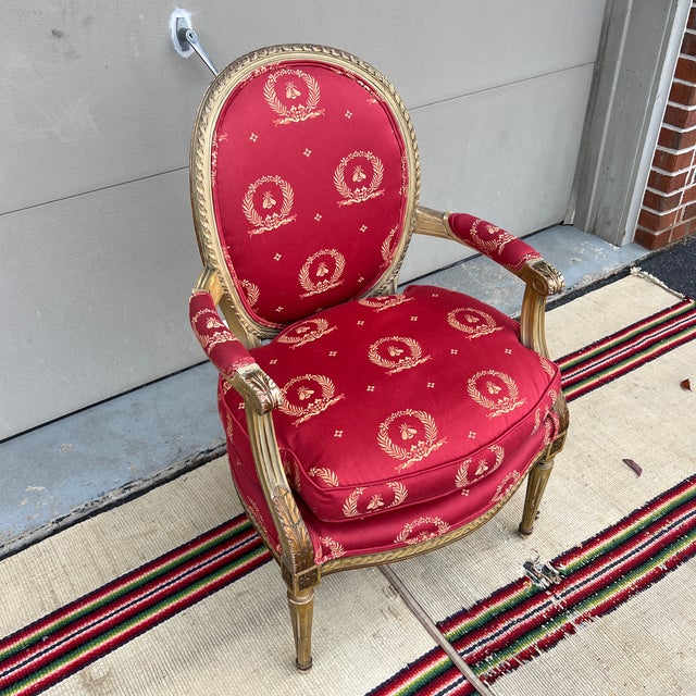 A Vintage Red Upholstered Painted Decorated and Carved French Bergere Arm Chair Probably made in France or Italy 1950's or...