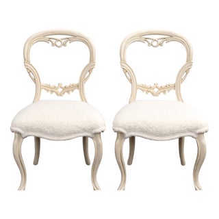 Pair of French-Style Dining Chairs With Carved Backs and White Bouclé Upholstery For Sale