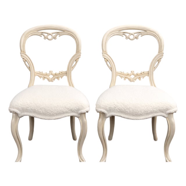 Pair of French-Style Dining Chairs With Carved Backs and White Bouclé Upholstery For Sale