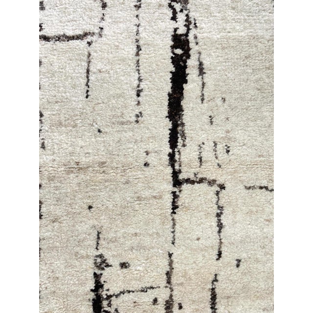 Beautiful hand knotted modern rug. Made of 75% wool and 25% cotton with very modern design and colors, this extremely...
