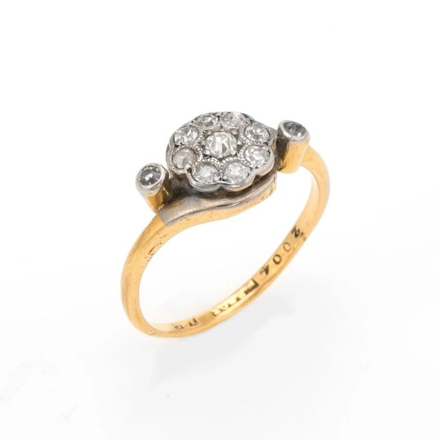 Finely detailed antique Victorian diamond cluster ring set with old mine cut diamonds (circa 1880s to 1900s), crafted in...