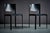 A refined pair of chairs defined by clean lines, a lightly curved backrest, and a restrained, architectural silhouette....