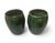 A pair of vintage ceramic pots features a rich, deep emerald green glaze with a high-gloss finish. The handcrafted nature...