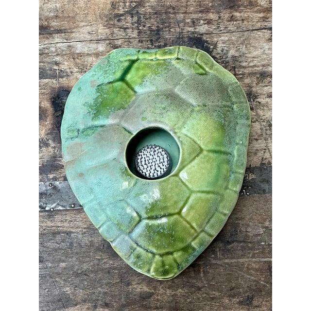 This charming vintage flower frog is masterfully sculpted in the form of a turtle shell, embodying the organic design...