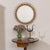 Lovely rattan circular mirror from Italy, 1960s. Beautiful looping rattan design encompassing the mirror. Nice vintage...