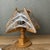 Vintage wooden sculptural table lamp with string-art geometric detailing. The combination of wood panels and white thread...