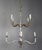 Wrought Iron silver gilt wrought i two-tier chandeliers. Each chandelier has eight candleholders with drip wax candle...