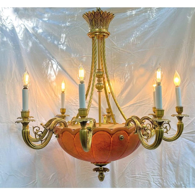 This solid-brass statement chandelier was salvaged from a Manhattan brownstone. It features 12 lights: eight arms and four...