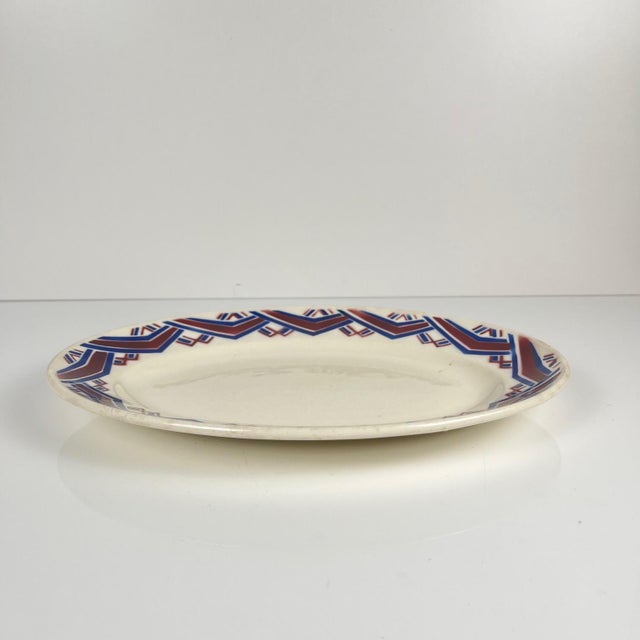 Antique oval platter "Babylon", Badonviller, 1900 Purple and red geometric pattern Dimensions: 32 x 22.5 cm Height: 3.5 cm...