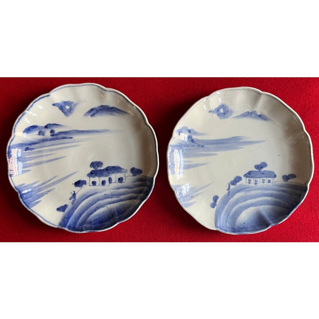 Pair antique 19th century Japanese Meiji blue & white porcelain plates decorated with a cottage and figure in a landscape....