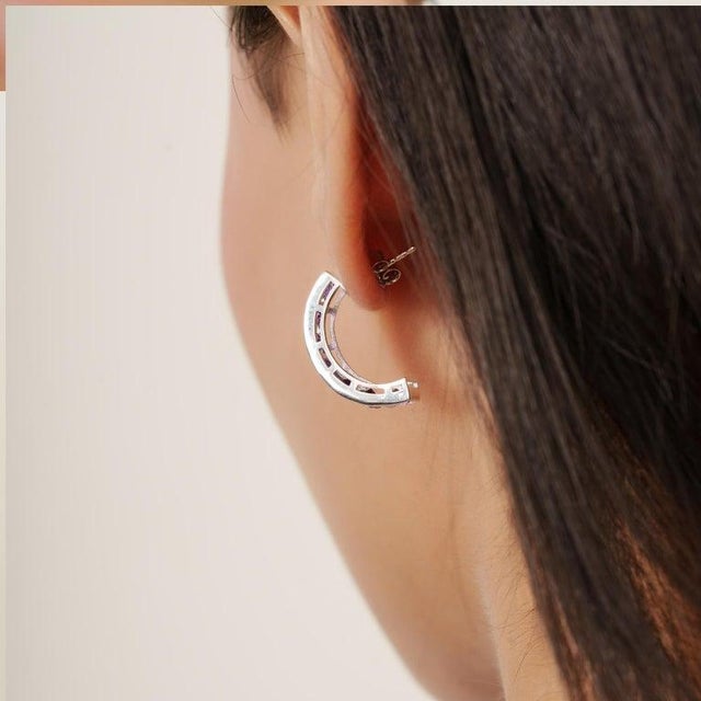 These earrings are crafted from 925 sterling silver and features 14 round-cut amethyst gemstones in a rich violet hue,...