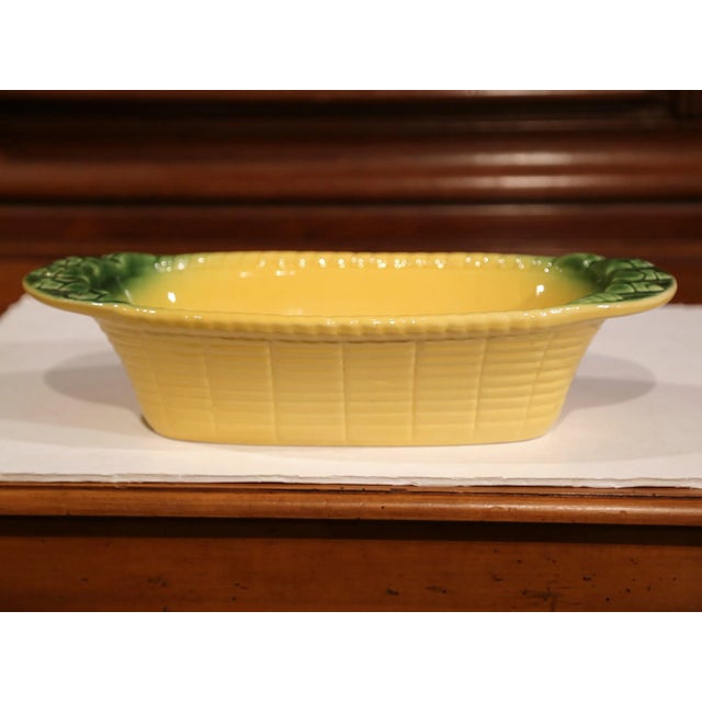 Add a touch of Provençal charm to a kitchen or dining table with this colorful antique majolica serving dish. Crafted in...