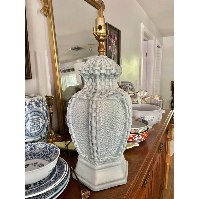 This ceramic faux basket weave table lamp is perfect for the vintage Palm Beach setting. It is a painted, pale blue and we...