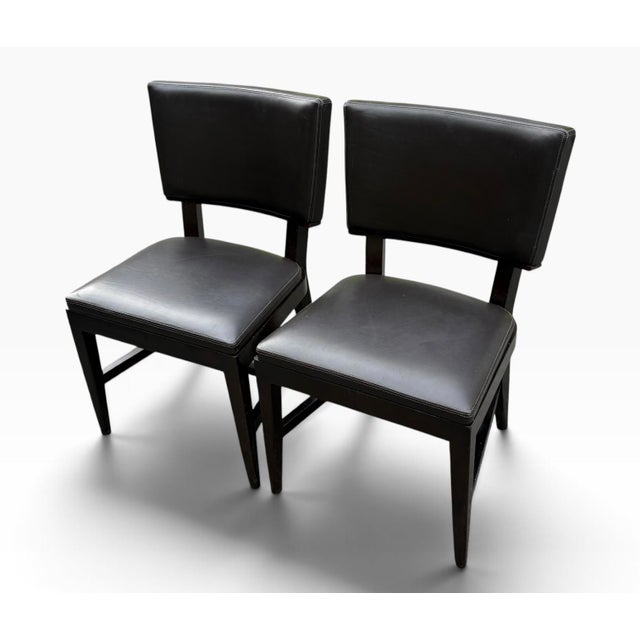 Very nice dark brown leather "Harry" dining chairs by Christian Liaigre. These chairs were introduced in 2016 and feature...