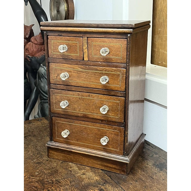 Victorian set of Mahogany table top chest of drawers. Has signs and use and wear. See pics Sizes :- 50 cms tall 33 cms...