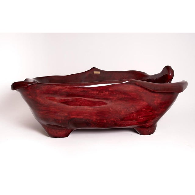 Unique functional sculpture carved from a single piece of wood in the shape of a bathtub. This magnificent bathtub is...