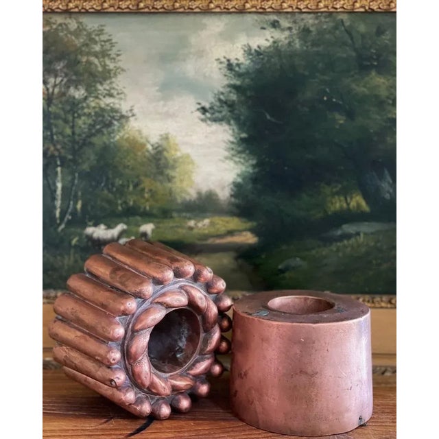A pair of copper molds with warm patina. The heavy molds are made of thick gauge copper and are impressed with a number.....