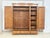 For sale is this beautiful, three-door Art Nouveau wardrobe made of oak with a beveled mirror and brass fittings, as seen...