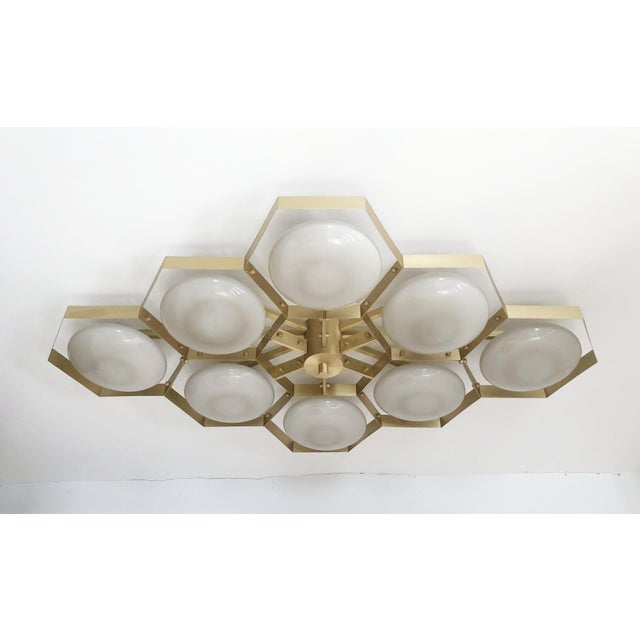 Italian midcentury flush mount with eight glossy gray Murano glass shades mounted on solid brass frame in satin brass...