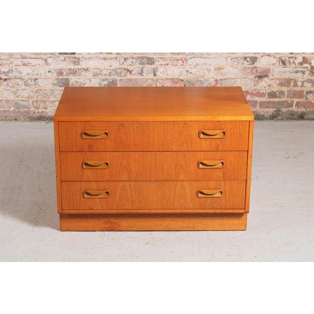 A midcentury g plan fresco chest of three drawers, circa 1960s. H: 54cm w: 81cm d: 46cm.