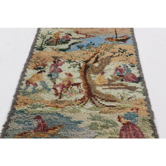 Hand-knotted in lush, high-pile wool in Sweden circa 1960-1970, this 4x6 vintage Swedish Rya rug is a bold new addition to...