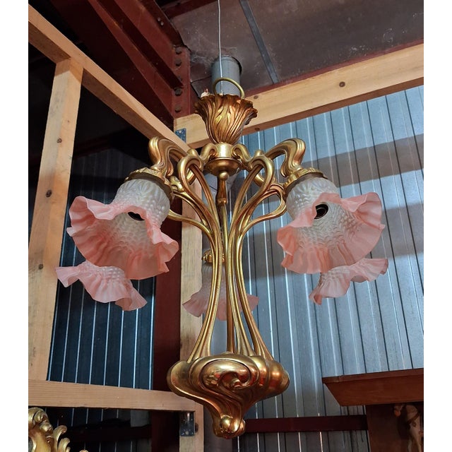 Art nouveau style five-light bronze chandelier / nancy school style / 1900 the gilt bronze frame features a remarkable...