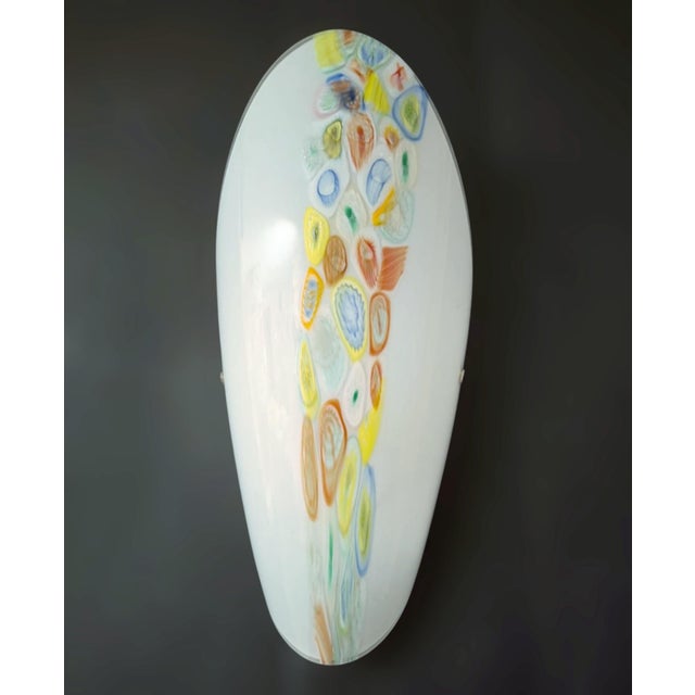 Vintage Italian wall lights with milky white oval shaped Murano glass shades hand blown with multicolored Murrine / Made...