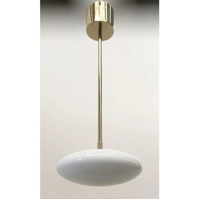 Italian pendant with glossy white Murano glass shade mounted on solid brass frame in lacquered polished brass finish /...
