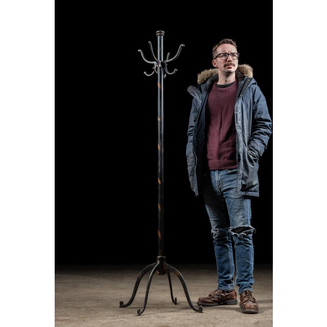 Antique cast iron coat tree. Despite its appearance, this coat rack not japanned copper, although it gets marks for...