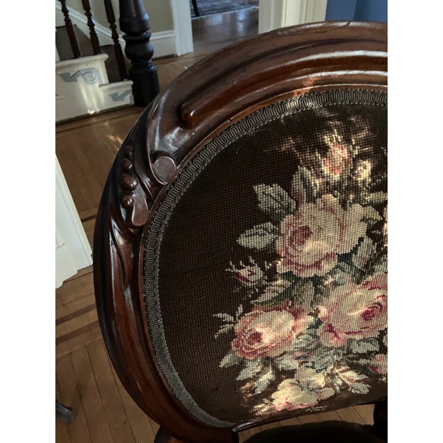 The chair is dark brown with elaborate needlepoint on the back. Exquisitely refurbished, structurally sound a d without...