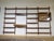 Modular mid-century "Royal" shelving system in teak by Poul Cadovius, 1960s. Wall-mounted construction with five...