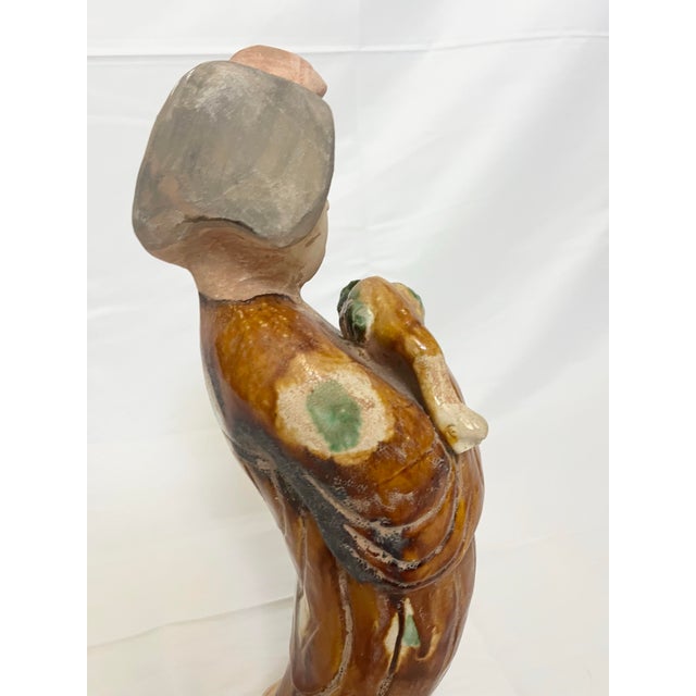 Add character and intrigue to your collection with this striking vintage Chinese ceramic figure. Crafted in the style of...