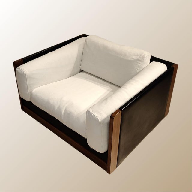 A pair of “Poltrona 920” armchairs designed by Afra and Tobia Scarpa for Cassina, 1966 design. Wooden frame with...