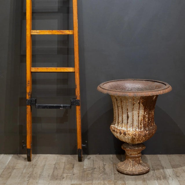 ABOUT A large antique distressed cast iron garden urn. CREATOR Unknown. DATE OF MANUFACTURE c.1890-1940. MATERIALS AND...