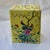 This Chinese export Famille Rose rectangular porcelain vase, pen holder, or brush pot, features intricate hand painted...