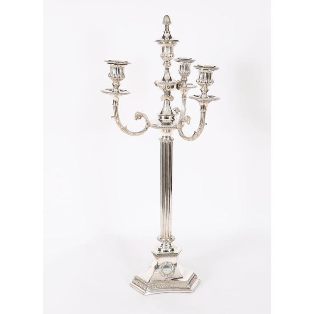 This is an imperative and highly distinguished pair of antique English Victorian silver-plated Neoclassical three branch /...