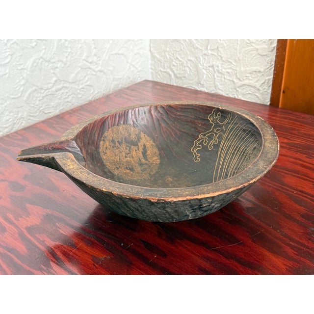 Carved Japanese wood bowl with a pouring lip. The shape follows the Japanese katakuchi, a lipped bowl used for pouring....