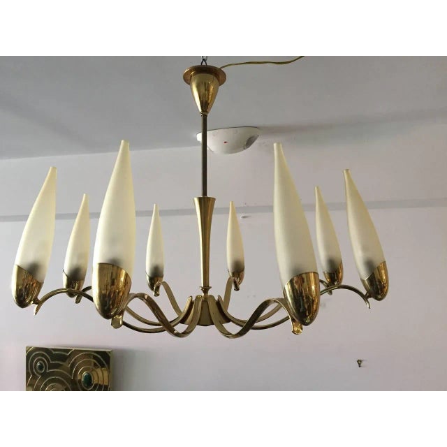 Stilnovo eight-arm brass and glass chandelier.