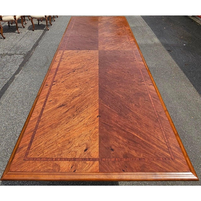 This Vintage Custom Carved French Walnut Dining Table is a spectacular dining piece that is rare, beyond elegant and...