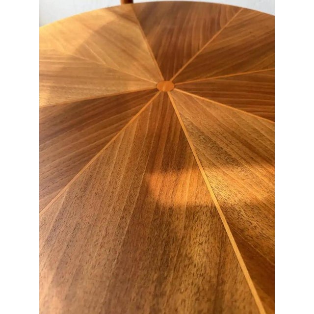 This round coffee table by Ilse Möbel brings together walnut, glass, and brass in a refined 1950s design. The table stands...