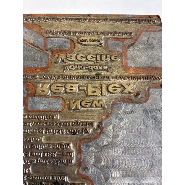 This pair of antique advertising letterpress printing plates offers a glimpse into the golden age of commercial printing....