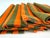 Set of six mid-century cotton napkins featuring bold alternating stripes in vibrant orange and deep olive green. The...