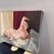 From her room you can find her lounging in bed bathed in sunlight. Intimate moments captured for your viewing. Original...