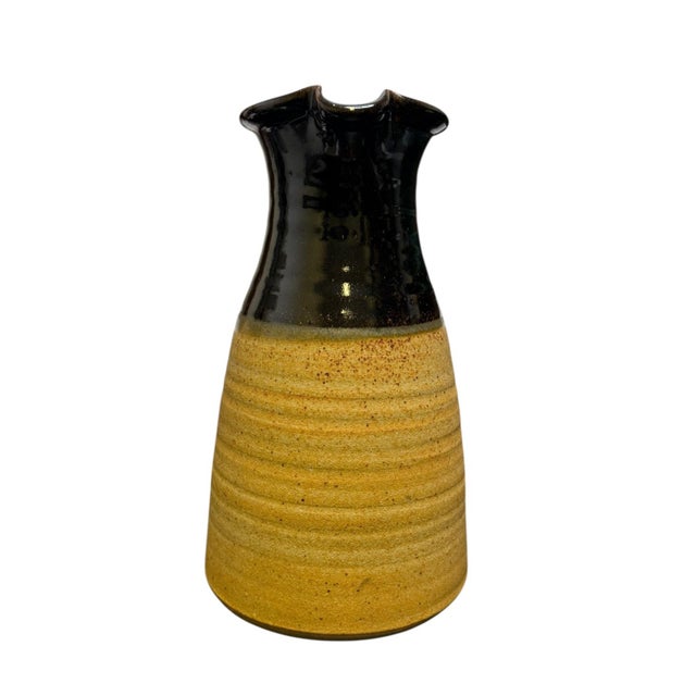A striking mid-century British studio pottery jug, characterised by its bold two-tone glazing and confident hand-thrown...