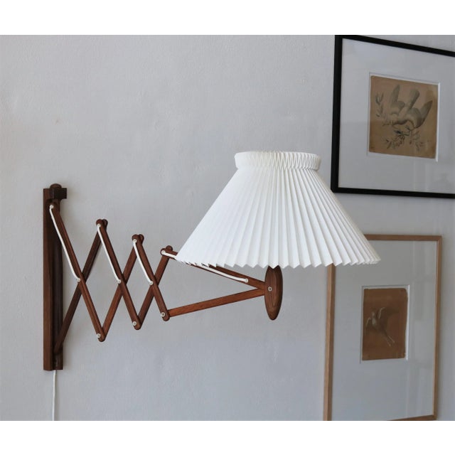 Rare rosewood edition of the iconic Le Klint ''Scissor'' wall lamp designed in the 1950s by Erik Hansen. The lamp can be...