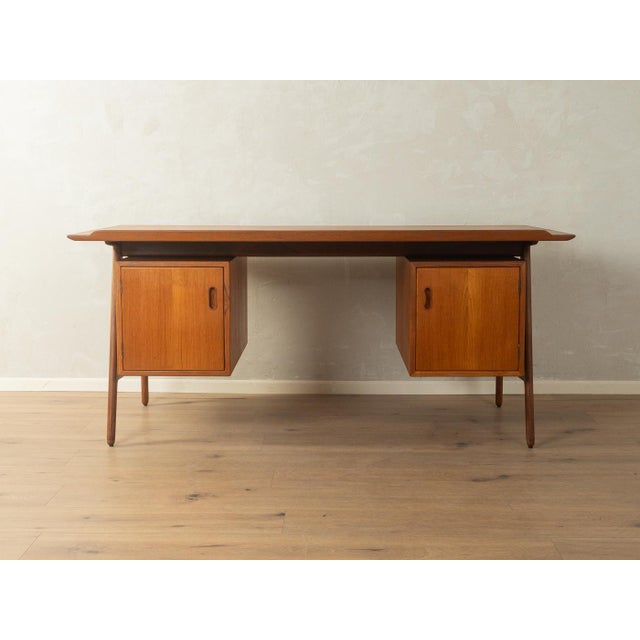 Rare freestanding desk by Arne Vodder for Vamo Sønderborg. High-quality teak veneer frame with five drawers, two doors at...