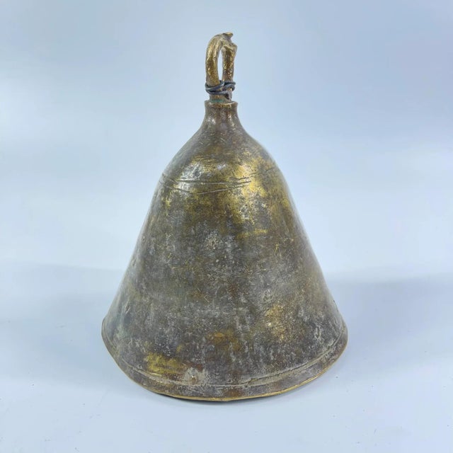 The brass metal bell was crafted by the Benue and Chamba artisans and metalworkers of Nigeria. These bells were often used...