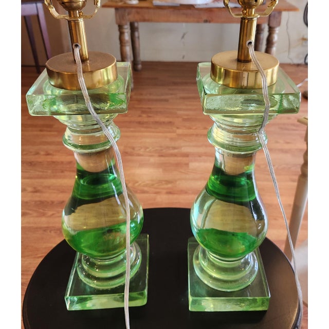 The design features a custom solid glass lamp. It has a brass cap holding the hardware for a 3 way bulb. Lamp has been...