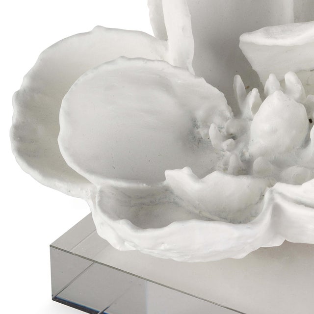 A beautiful magnolia cast in bloom brightens up your living room. Its white finish and acrylic pedestal base take it into...